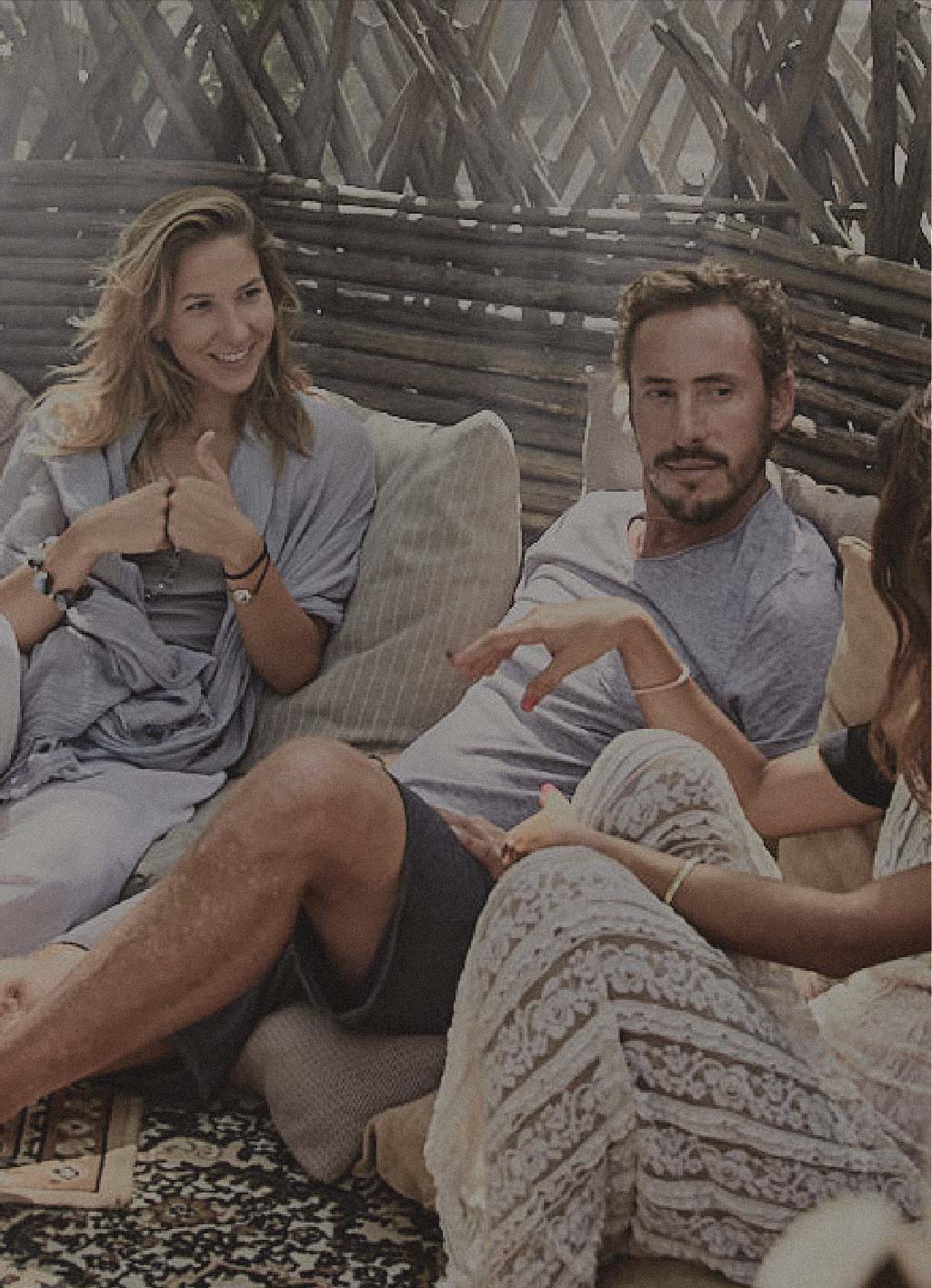 people relaxing and having chat each others in a tent at nomade Tulum