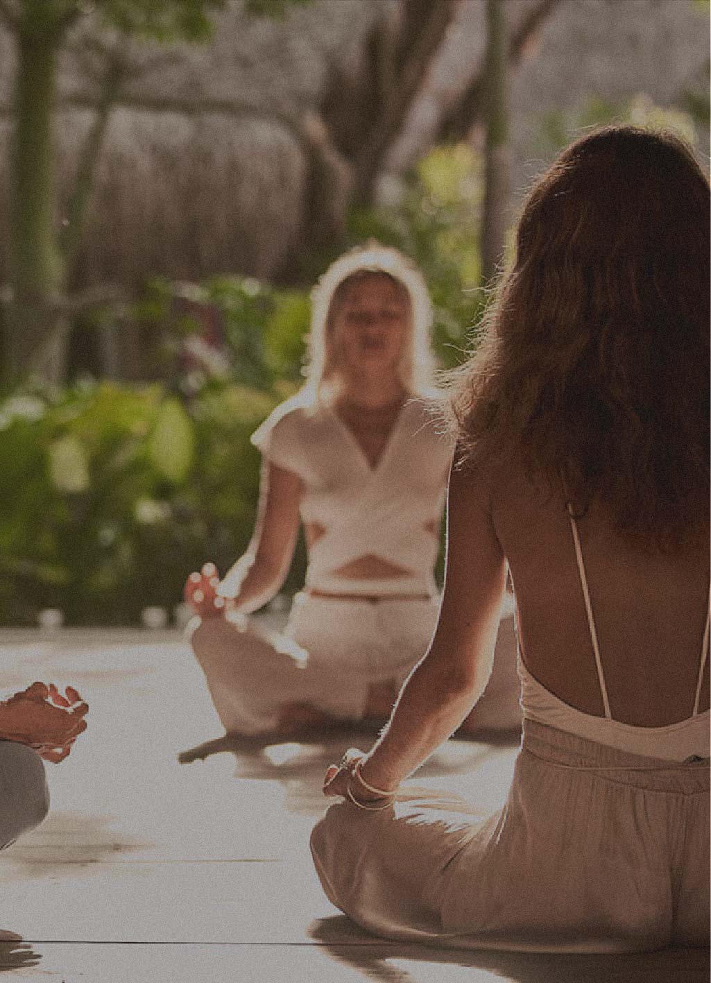 women taking a yoga session as spirit wellness at nomade Tulum