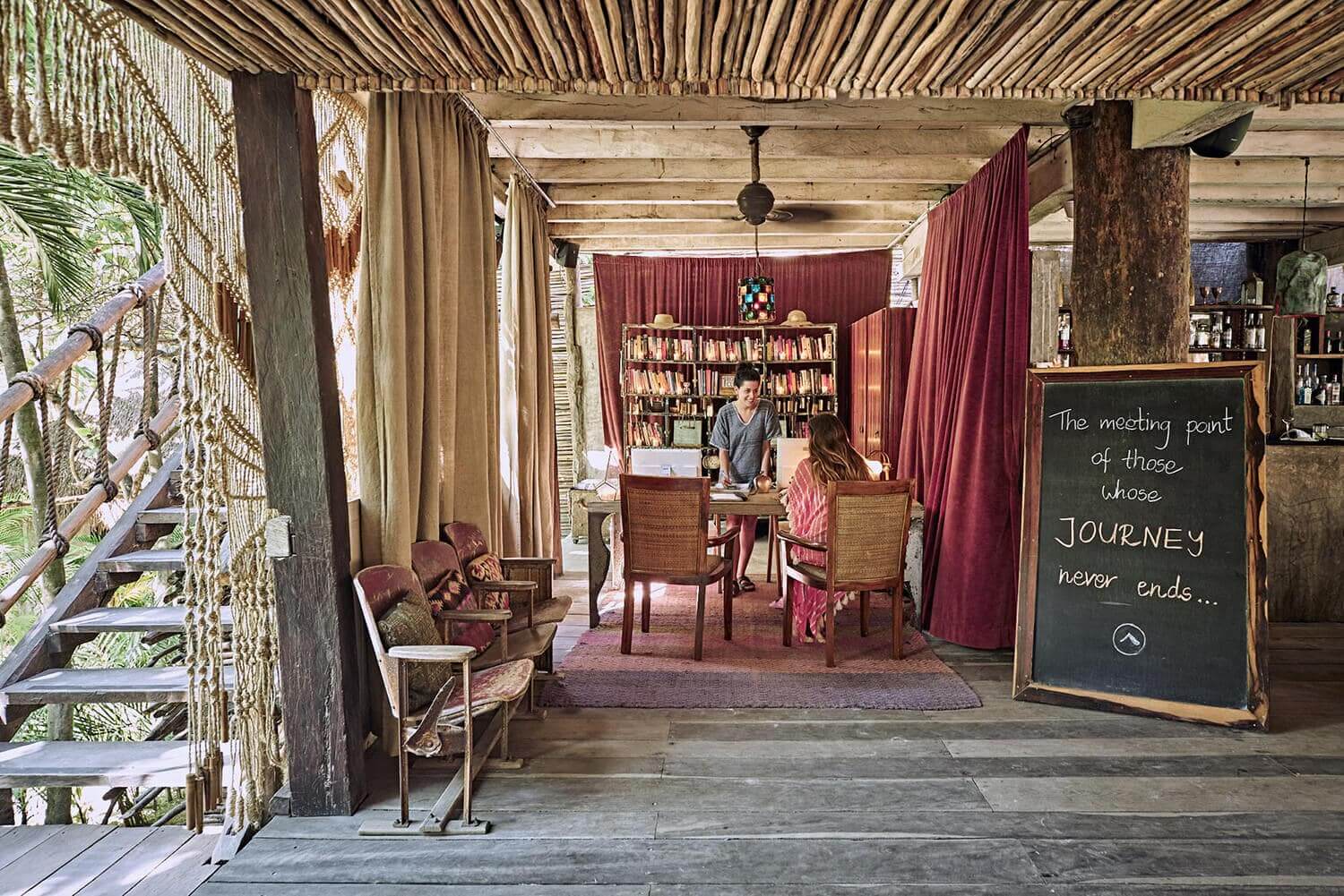 women in the library at nomade Tulum