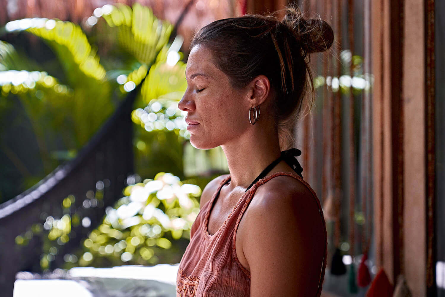 woman relaxing pacefully in her room at nomade Tulum