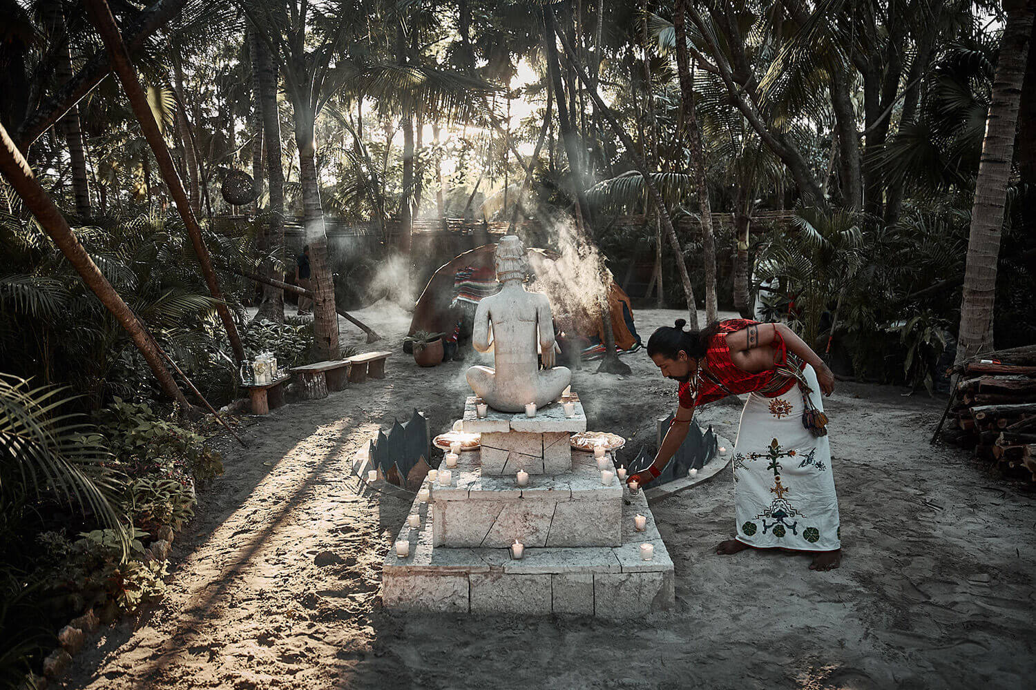 person who starting a prehispanic ceremony at nomade Tulum